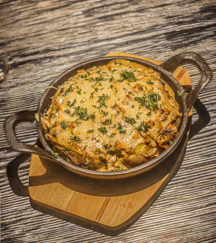 Baked potato with wild mushrooms in cream sauce